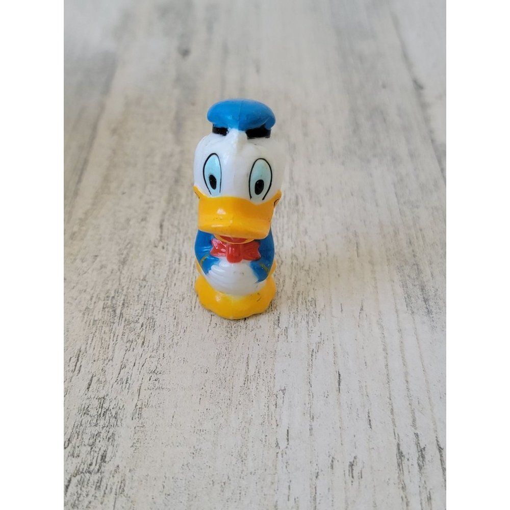 Vintage miniature Donald Duck blue outfit hand fold bow toy figure